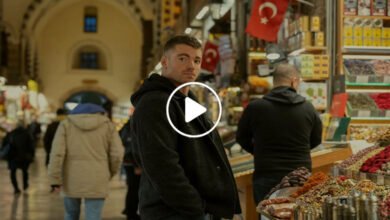 Peter Sutherland in a tense final scene from The Night Agent Season 3, standing in a dimly lit operations room reviewing classified intelligence files.