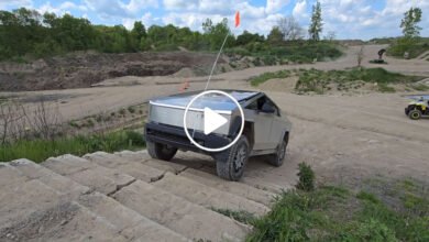 Tesla Cybertruck parked outdoors showcasing its stainless-steel body design during a limited-time pricing opportunity.